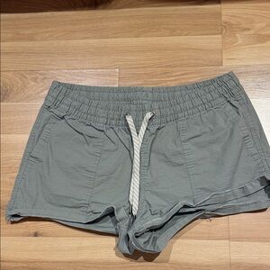 Vuori Women's Athletic Shorts in olive green,